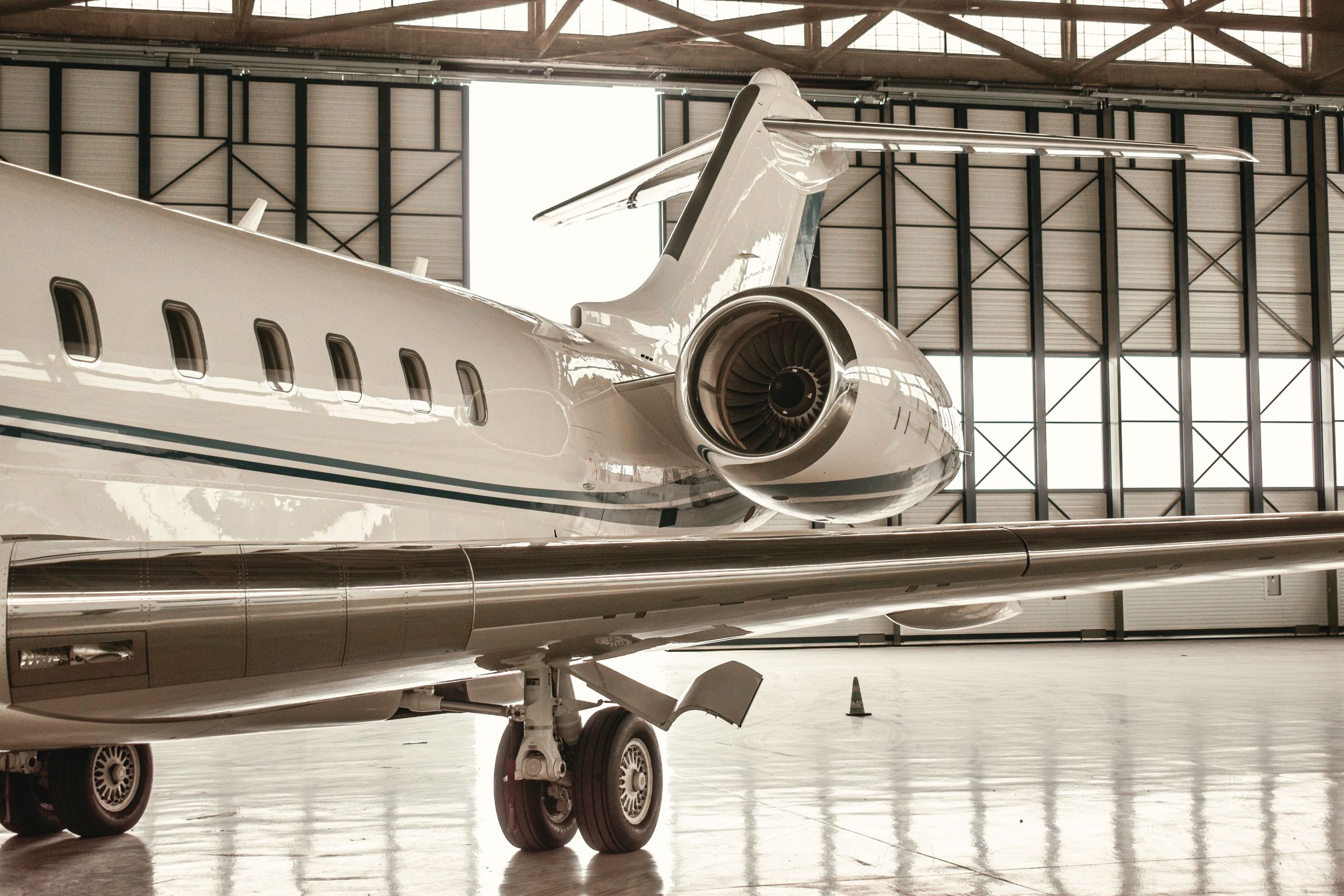 Business jet inside a hangar — licensed illustrative stock photograph