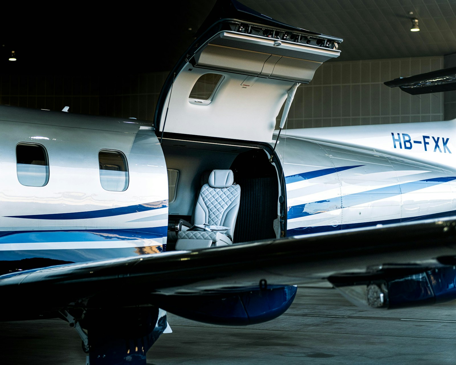 Pilatus PC-12 in a hangar — illustrative stock photo